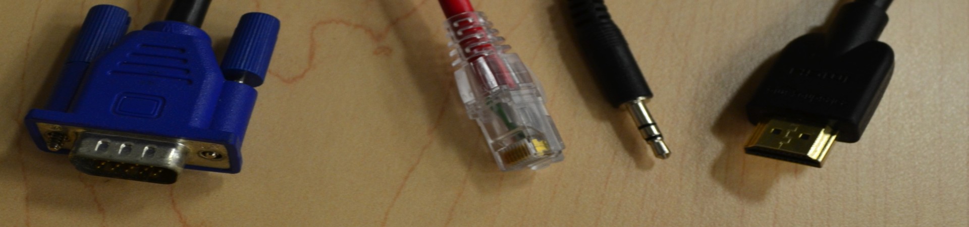 An HDMI, 3.5mm Audio, JR45 Ethernet, and VGA cables