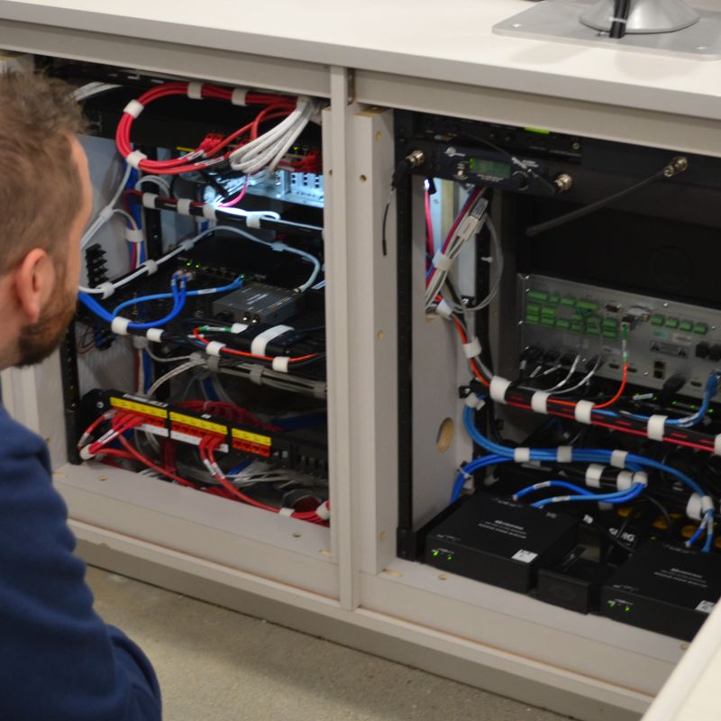 CTG Team member investigating an Audio Visual installation