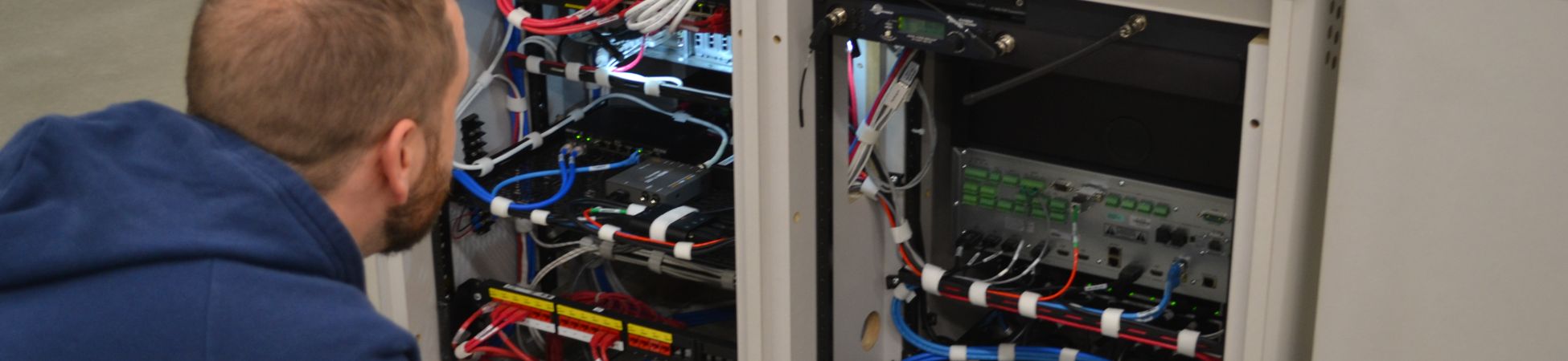 CTG Team member investigating an Audio Visual installation