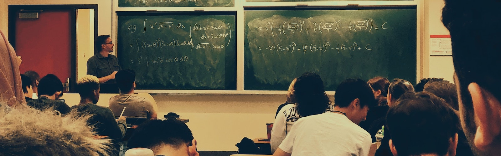 Male instructor presents a math lecture