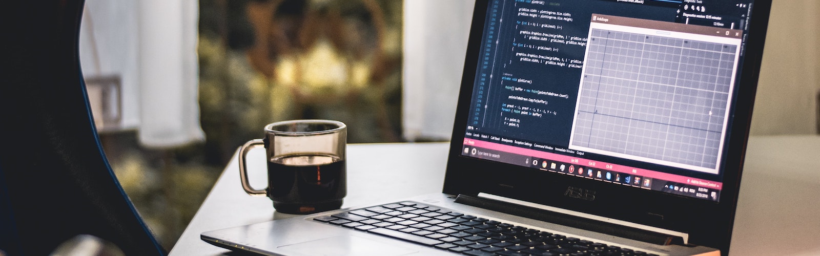 Coffee and laptop on desk