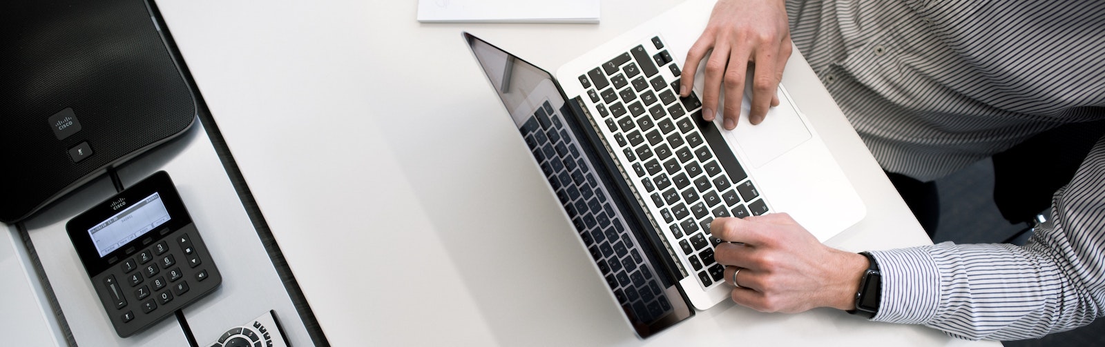 Man Typing on laptop 